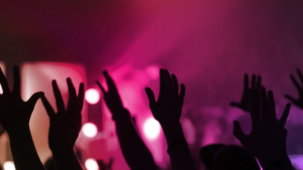 party-goer-raising-hands-up